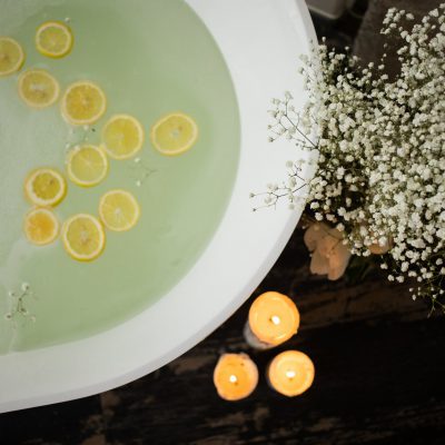 bathtub with candles and flowers
